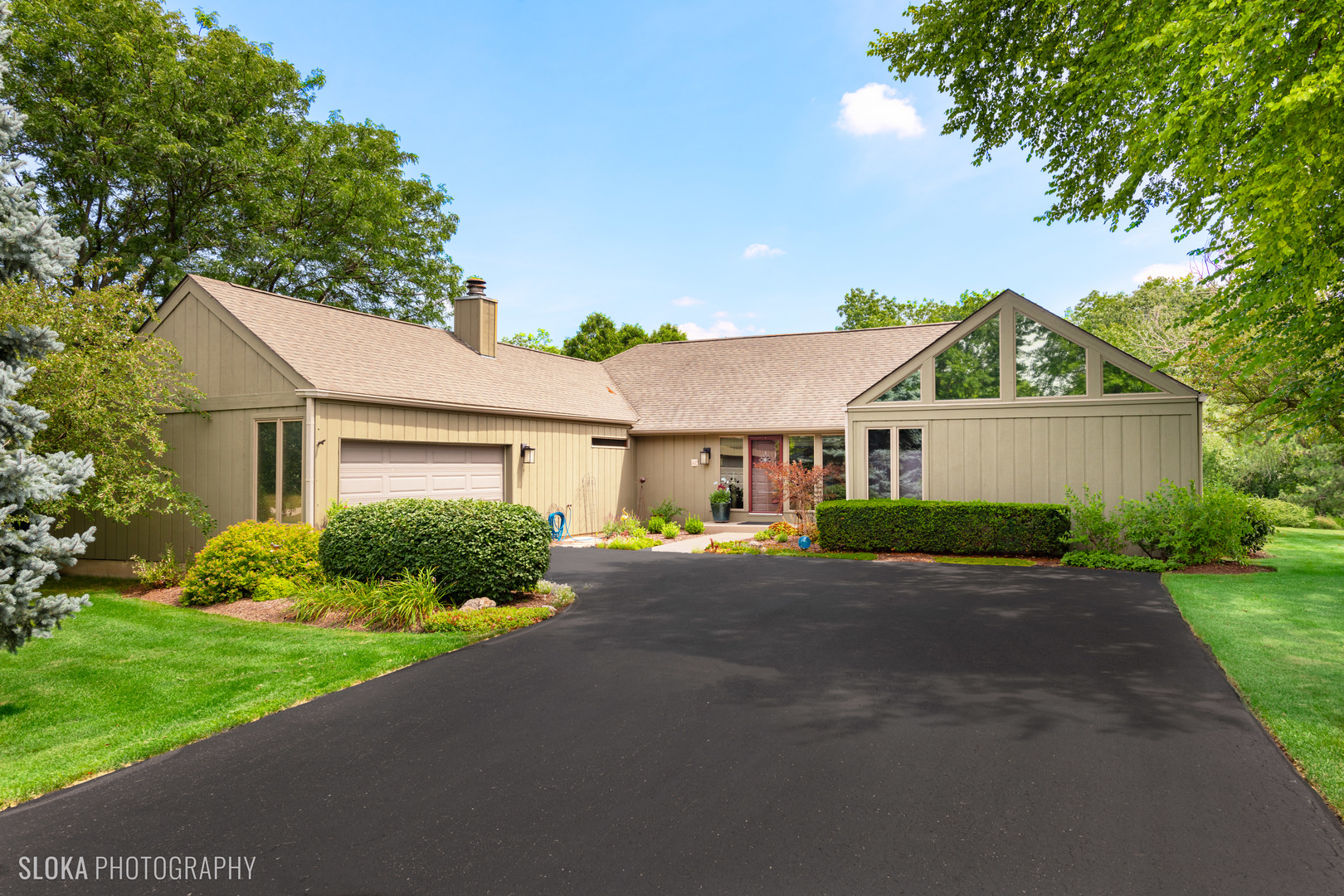 2920 Springbrook Road Crystal Lake, IL 60012 - Photo 1 of 39 a front view of a house with a yard and garage