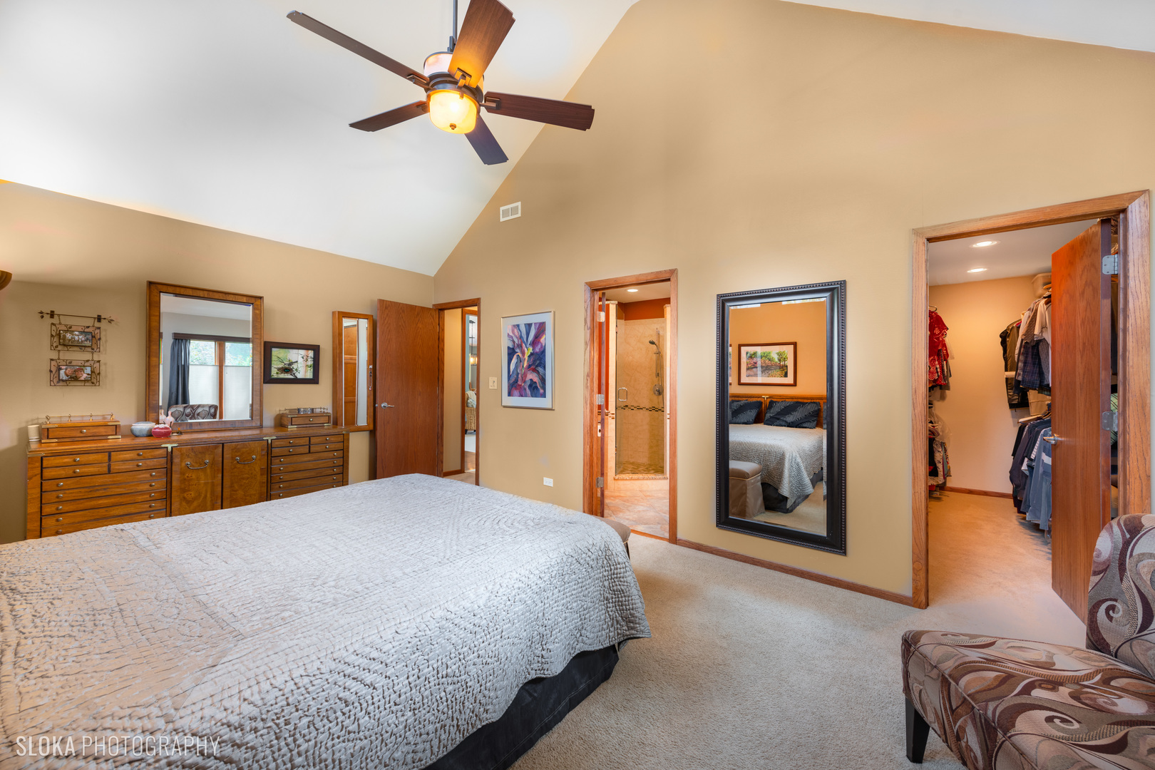 2920 Springbrook Road Crystal Lake, IL 60012 - Photo 16 of 39 a bedroom with a large bed and a chandelier