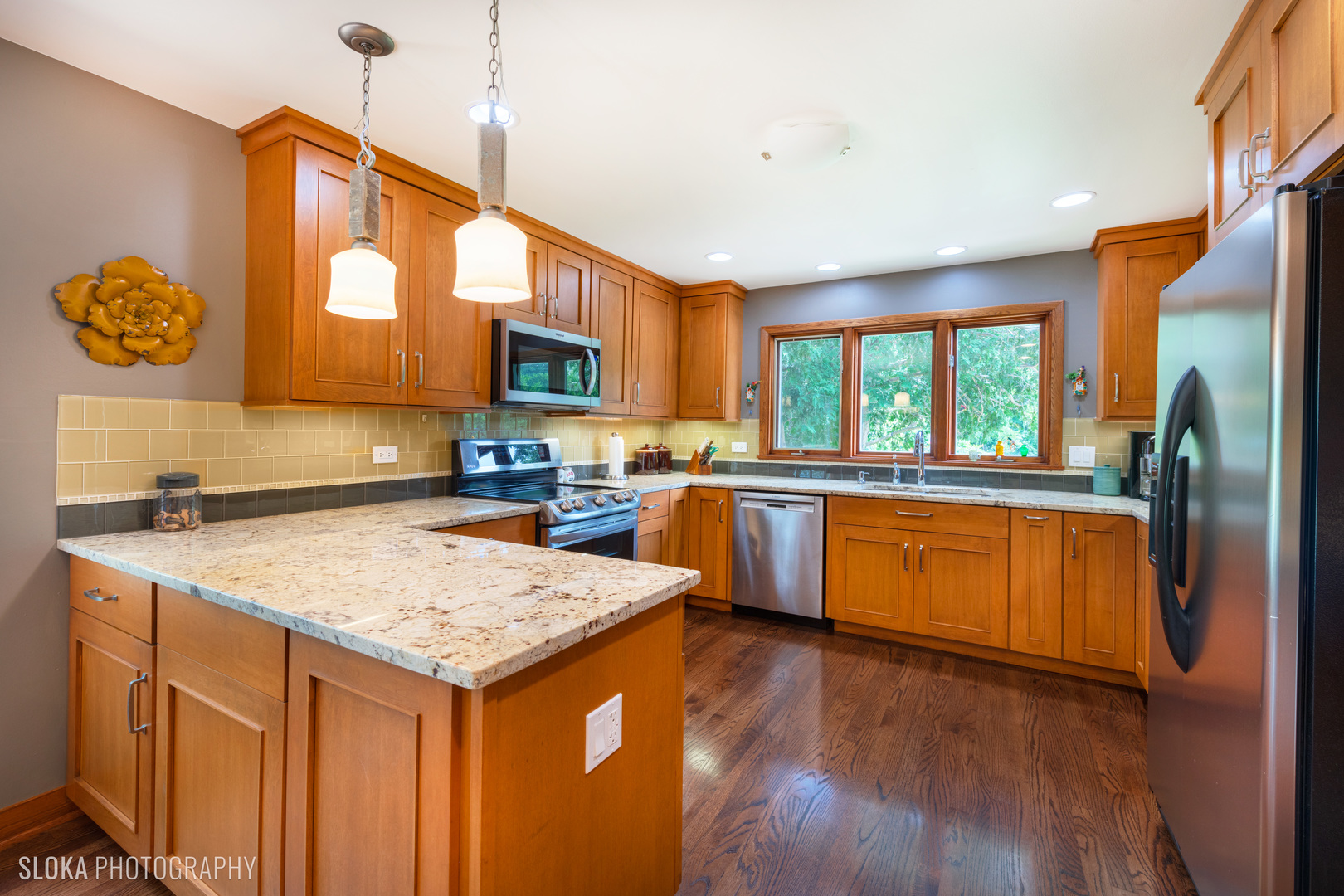 2920 Springbrook Road Crystal Lake, IL 60012 - Photo 7 of 39 a kitchen with a sink a counter top space and stainless steel appliances