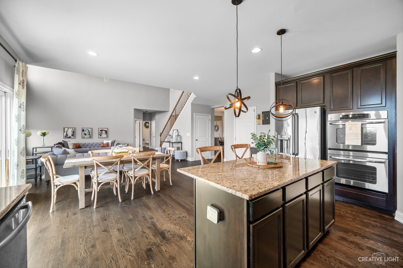 672 Ridgeview Lane Sugar Grove, IL 60554 - Photo 14 of 35 a kitchen with a table chairs sink and refrigerator