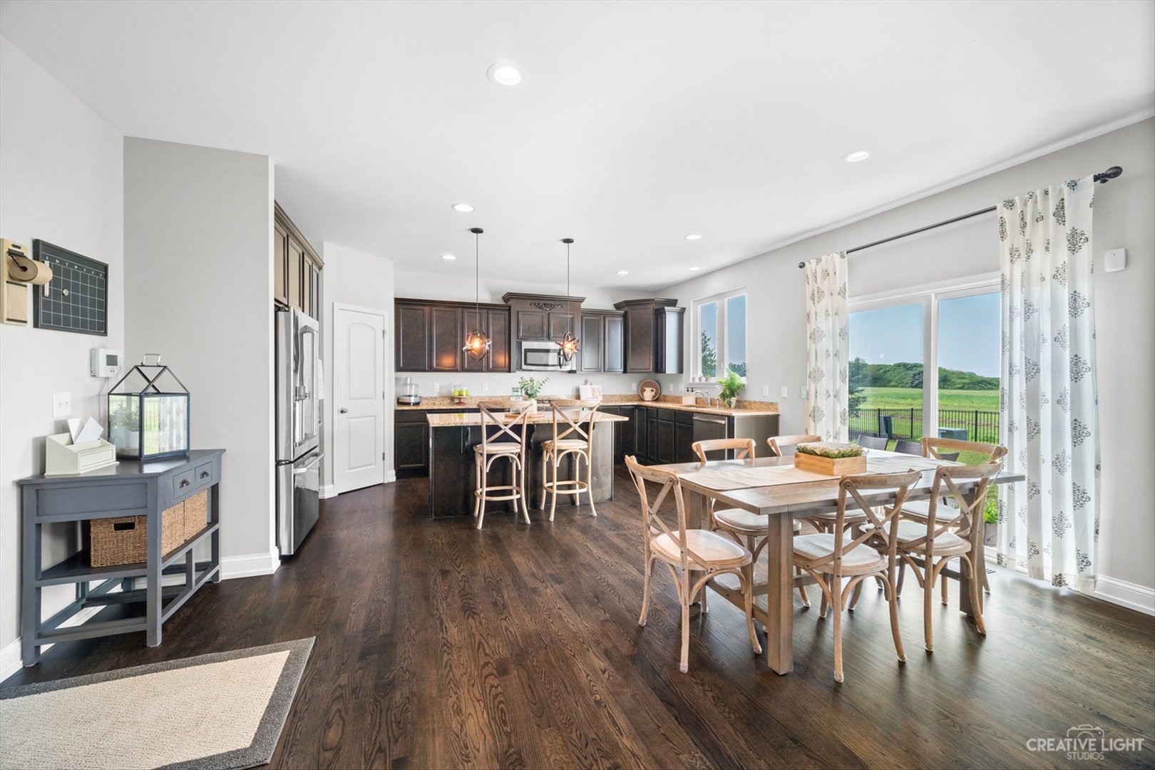 672 Ridgeview Lane Sugar Grove, IL 60554 - Photo 15 of 35 a view of a dining room with furniture and wooden floor
