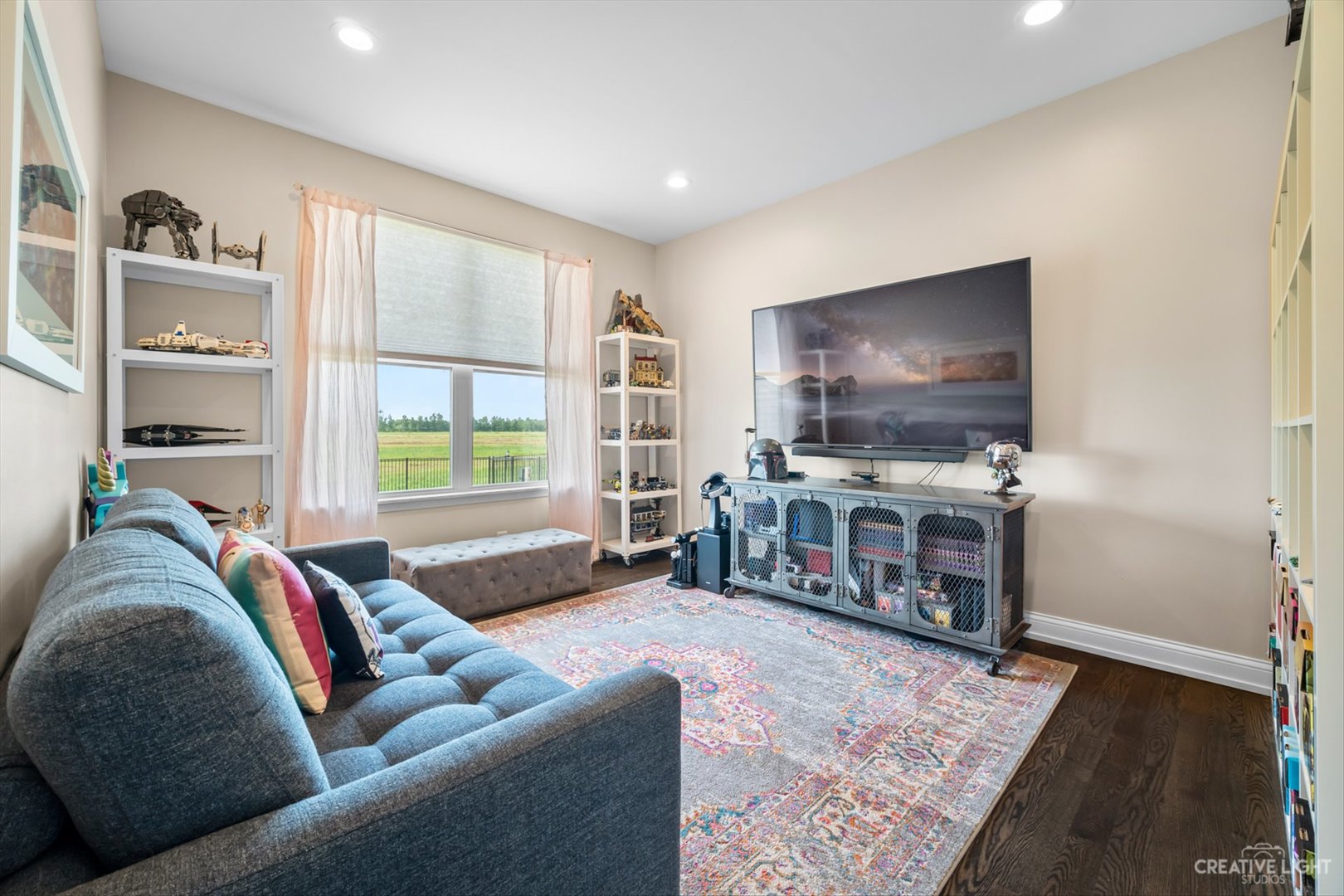 672 Ridgeview Lane Sugar Grove, IL 60554 - Photo 16 of 35 a living room with furniture and a flat screen tv