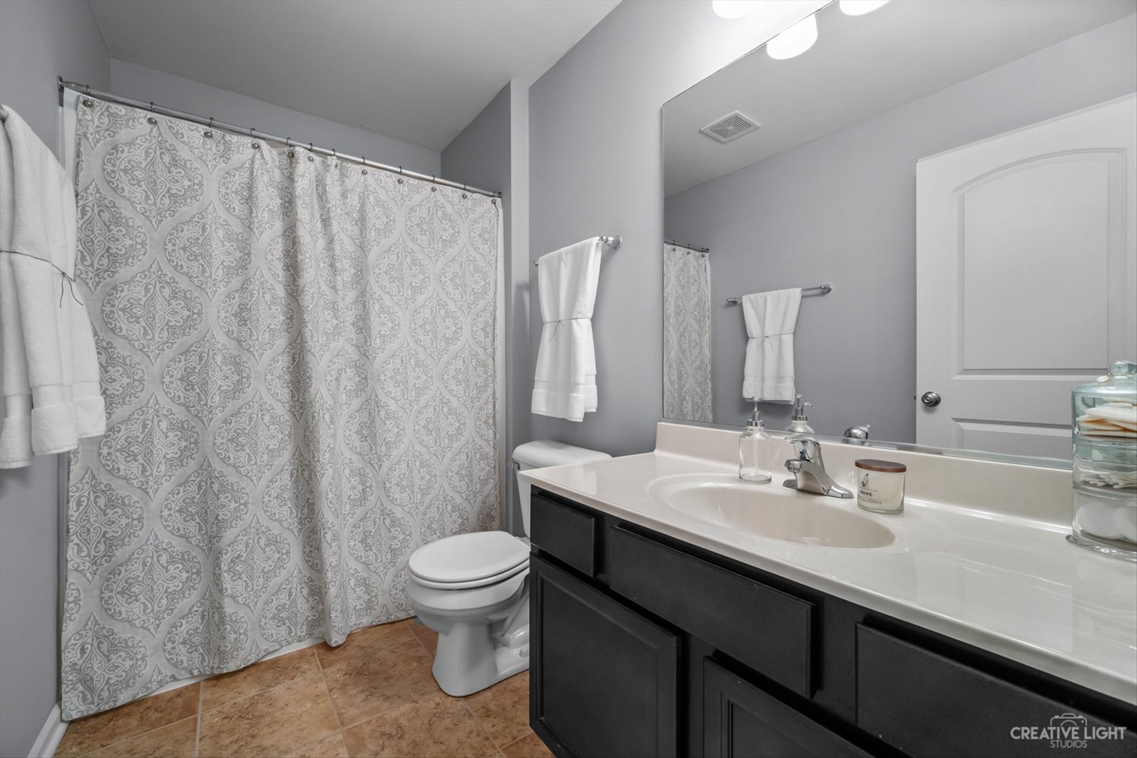 672 Ridgeview Lane Sugar Grove, IL 60554 - Photo 28 of 35 a bathroom with a sink a toilet and a mirror