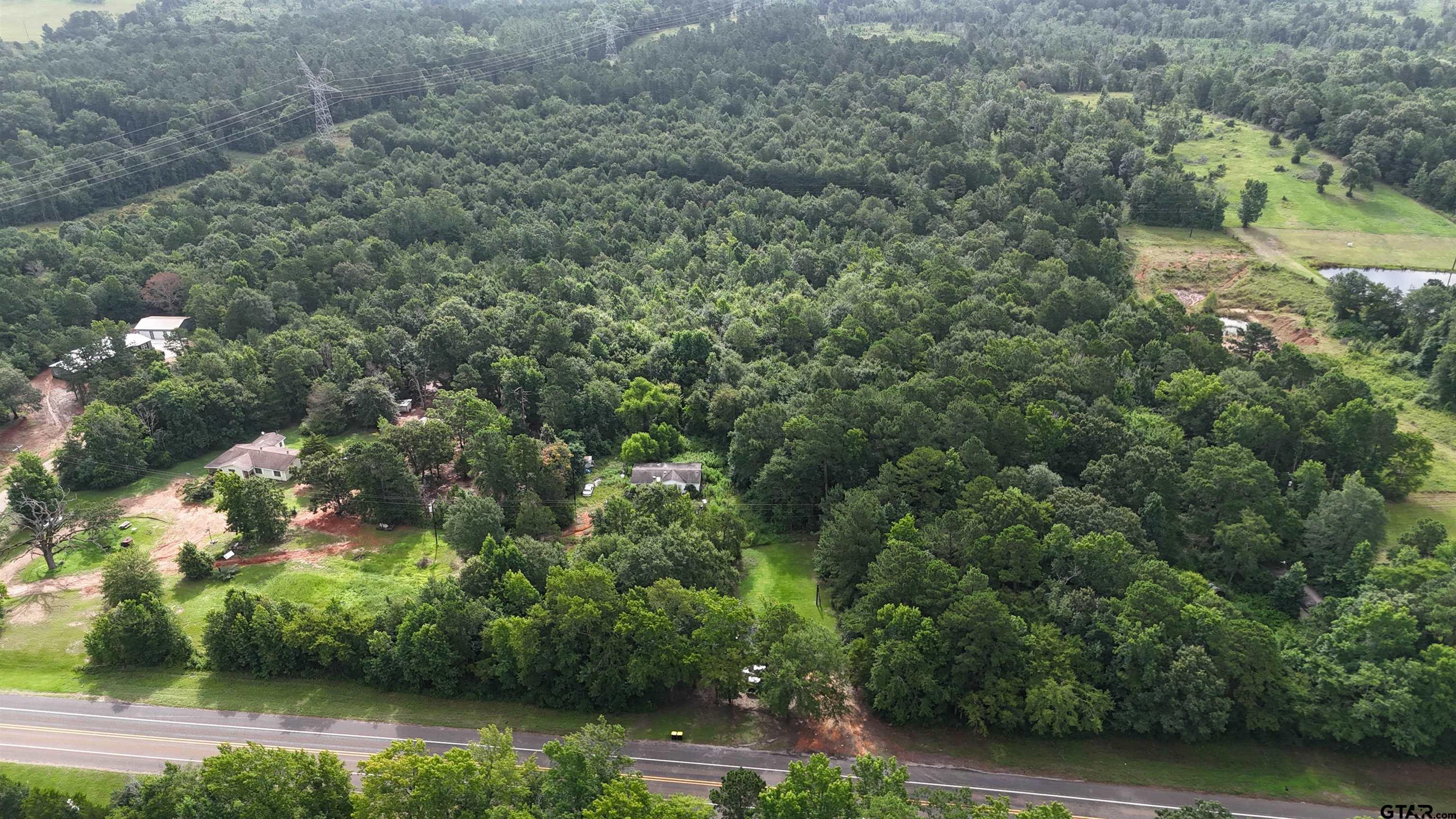 135 Highway 135 Overton, TX 75684 - Photo 2 of 3 an aerial view of residential house with outdoor space and trees all around