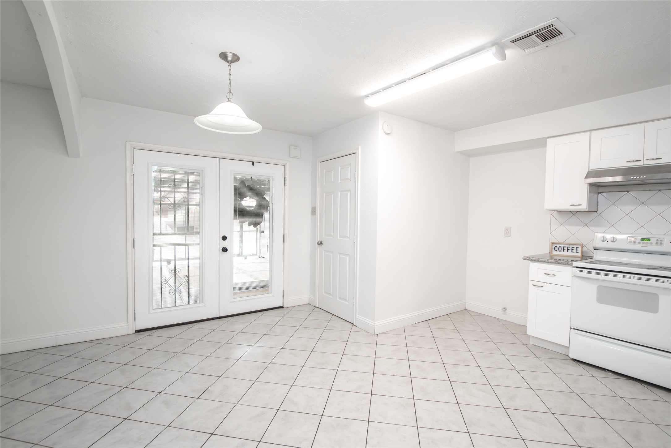 7237 Cook Road Houston, TX 77072 - Photo 12 of 21 a view of a kitchen with an empty space and a window
