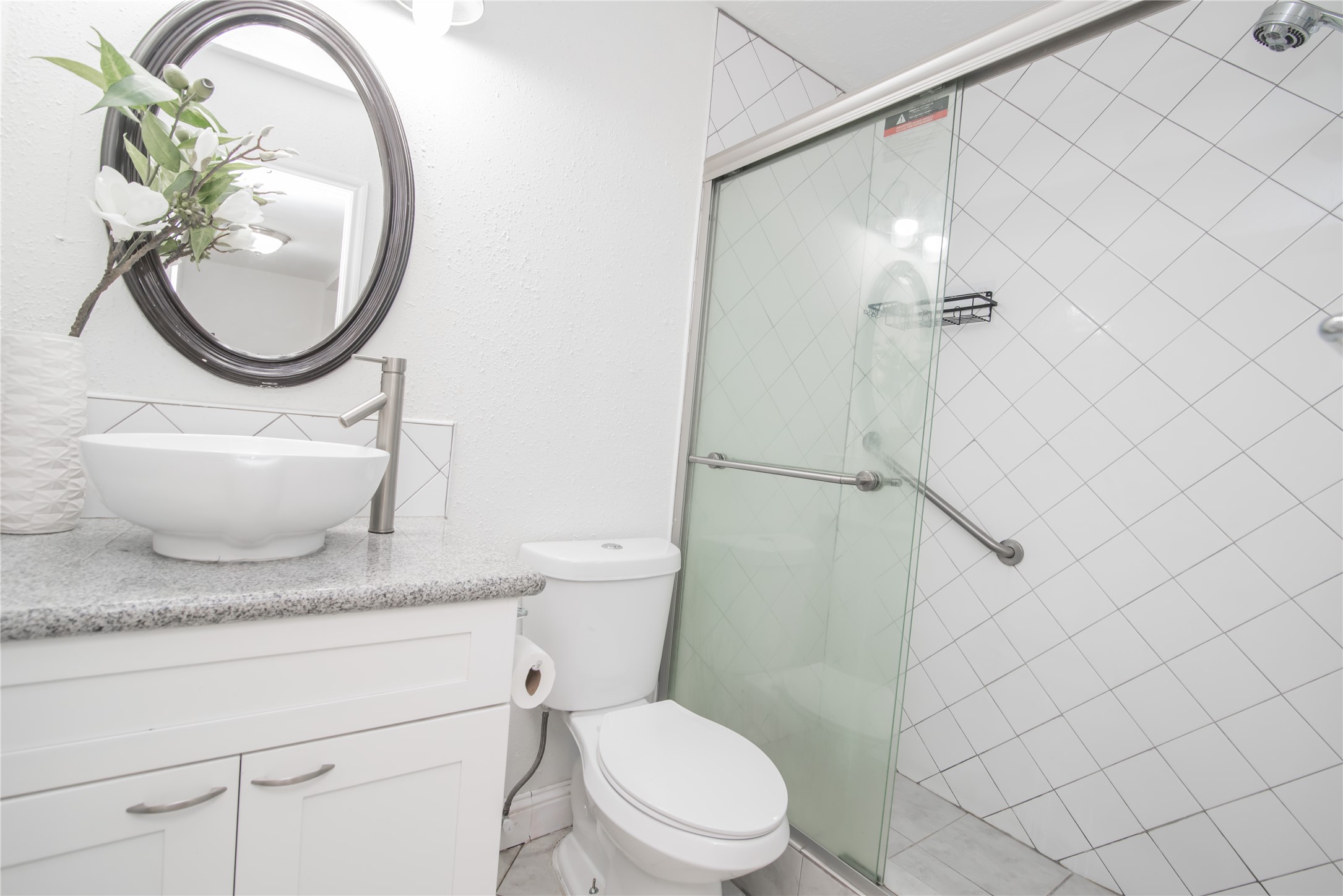 7237 Cook Road Houston, TX 77072 - Photo 16 of 21 a bathroom with a granite countertop toilet sink and mirror