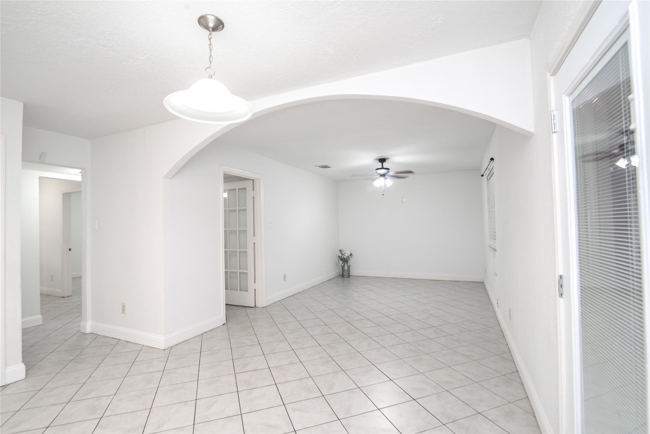 7237 Cook Road Houston, TX 77072 - Photo 7 of 21 a view of an empty room with a window