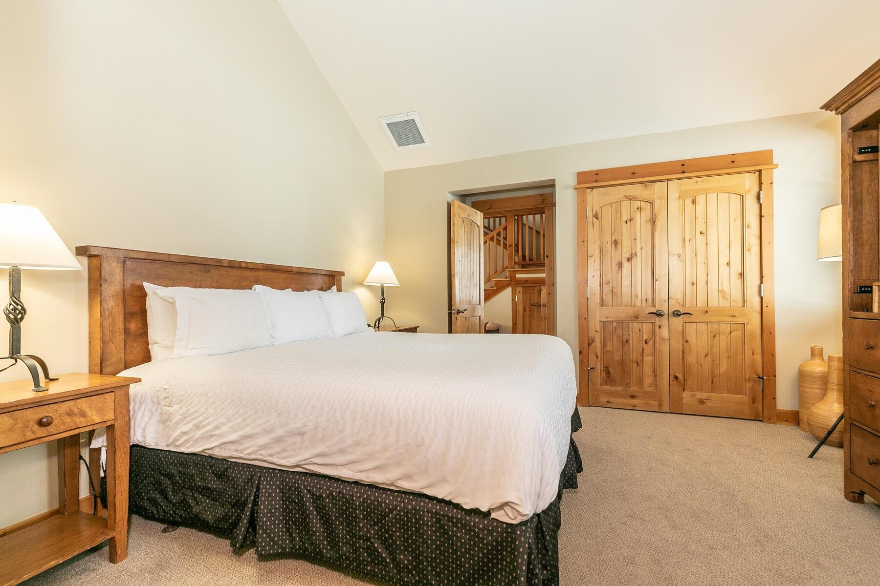 12381 Lookout Loop, Unit F1322 Truckee, CA 96161 - Photo 16 of 18 a bedroom with a bed and a cabinets
