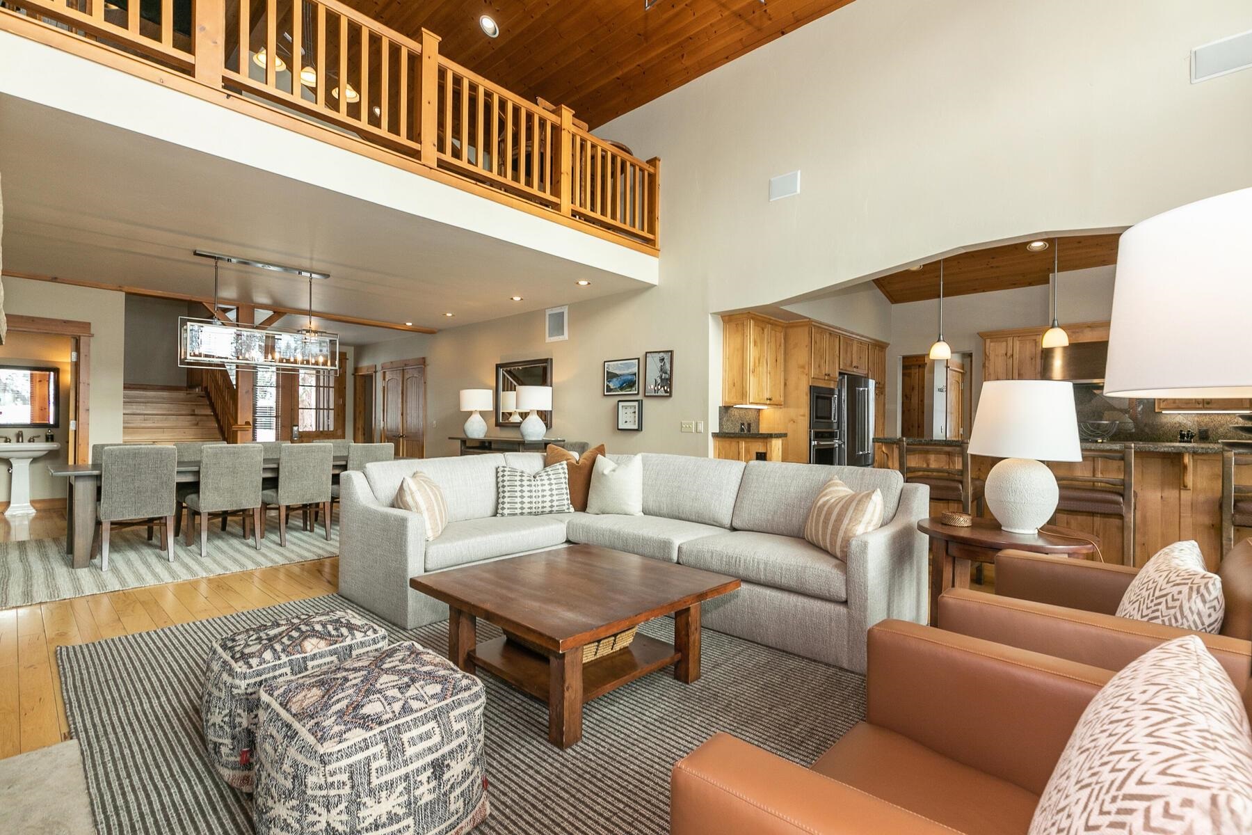12381 Lookout Loop, Unit F1322 Truckee, CA 96161 - Photo 6 of 18 a living room with furniture a rug and a chandelier