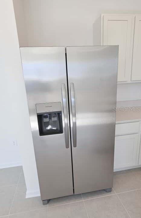 548 Hart Lane Dundee, FL 33838 - Photo 11 of 39 a close view of a refrigerator in kitchen