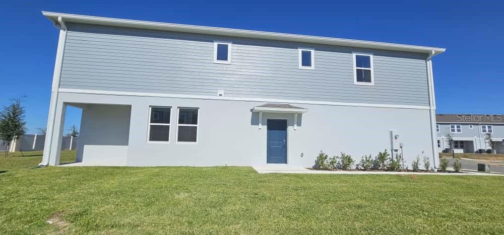 548 Hart Lane Dundee, FL 33838 - Photo 33 of 39 a front view of a house with garden