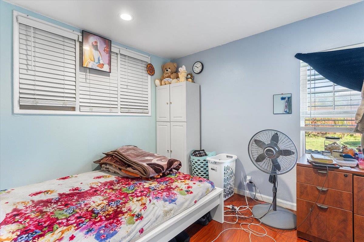 33834 9th Street Union City, CA 94587 - Photo 12 of 25 a bedroom with a bed and a chandelier