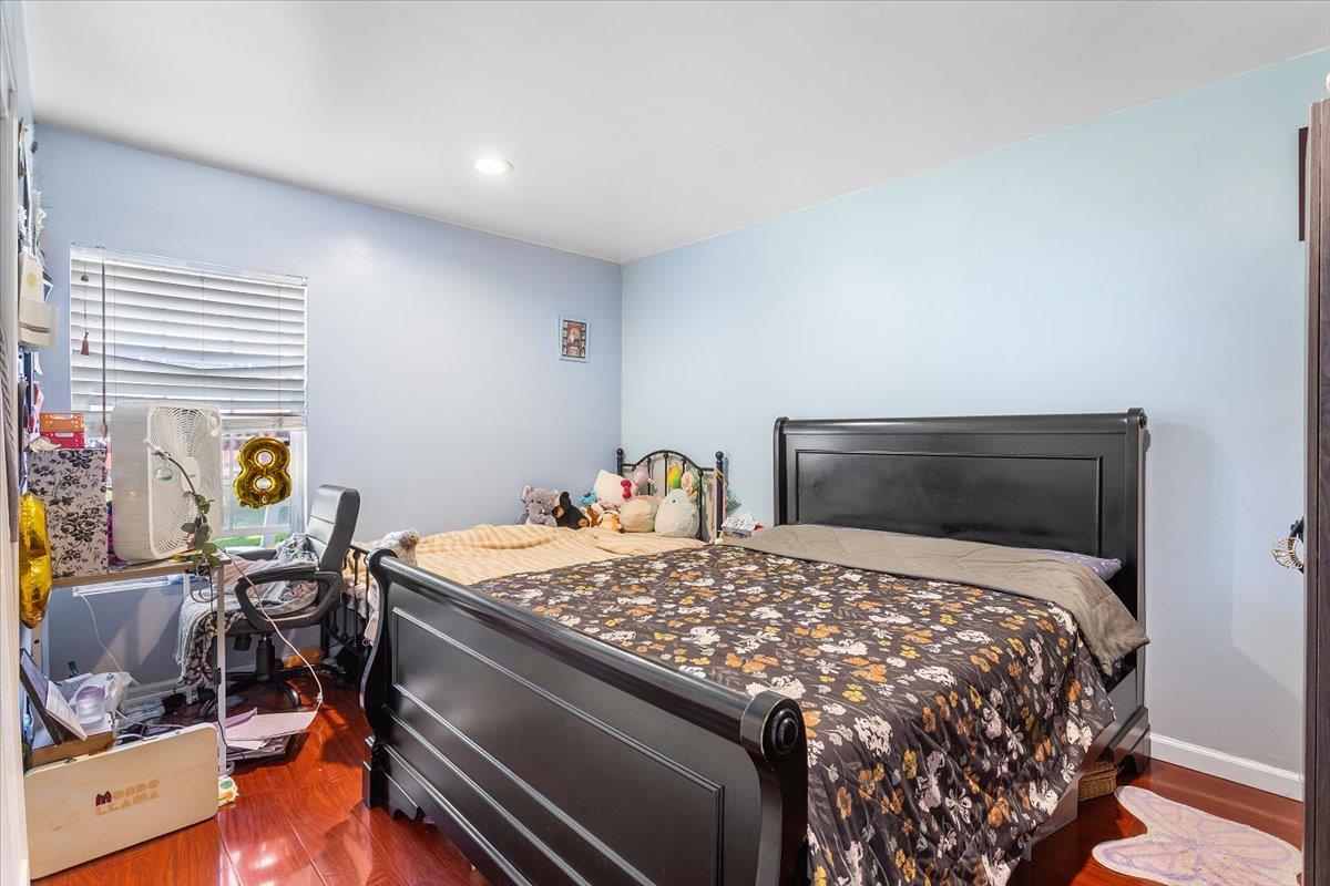 33834 9th Street Union City, CA 94587 - Photo 14 of 25 a bed sitting in a bedroom next to a window