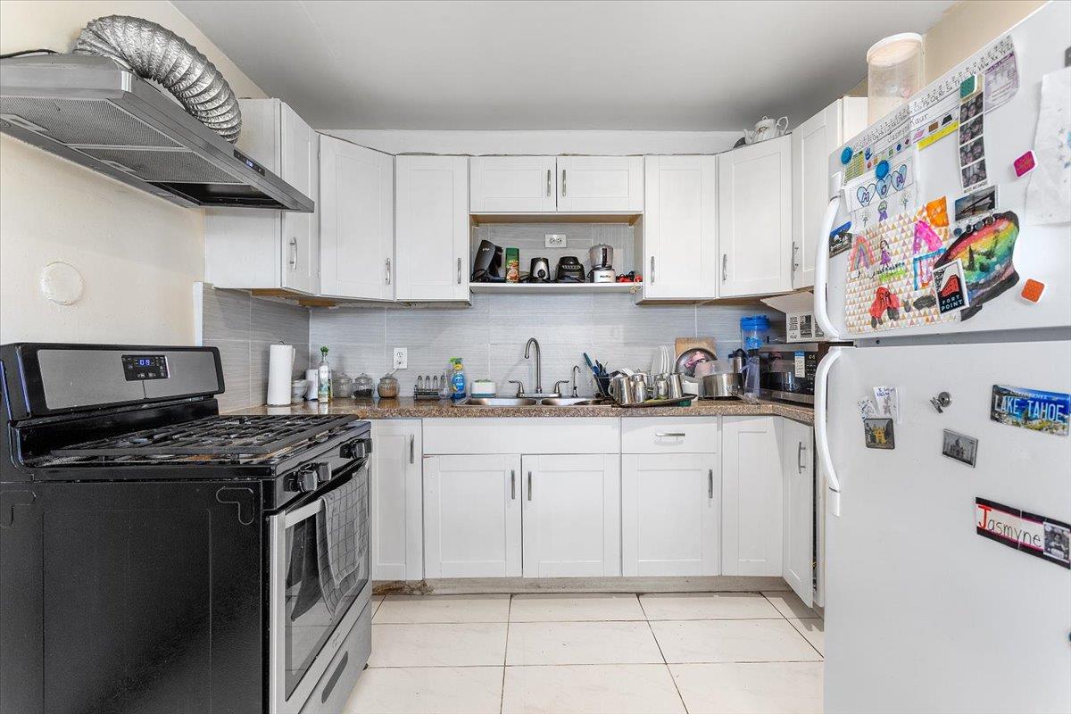 33834 9th Street Union City, CA 94587 - Photo 17 of 25 a kitchen with stainless steel appliances granite countertop a stove and a refrigerator