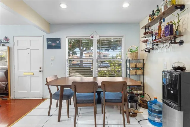 a view of a dining room with furniture and a window