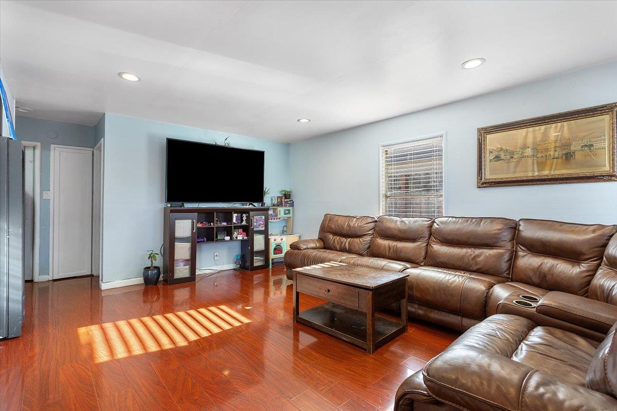 33834 9th Street Union City, CA 94587 - Photo 8 of 25 a living room with furniture and a flat screen tv