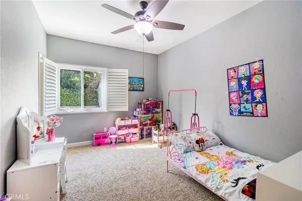 a bedroom with toys and a wooden floor