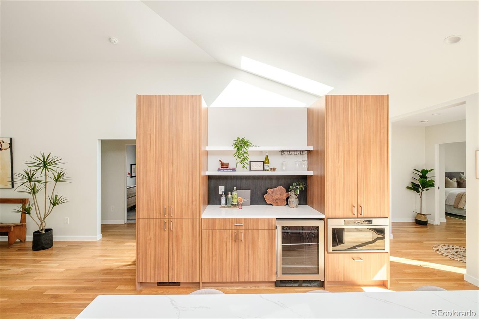 4100 Raleigh Street Denver, CO 80212 - Photo 19 of 48 a living room with stainless steel appliances kitchen island furniture and wooden floor