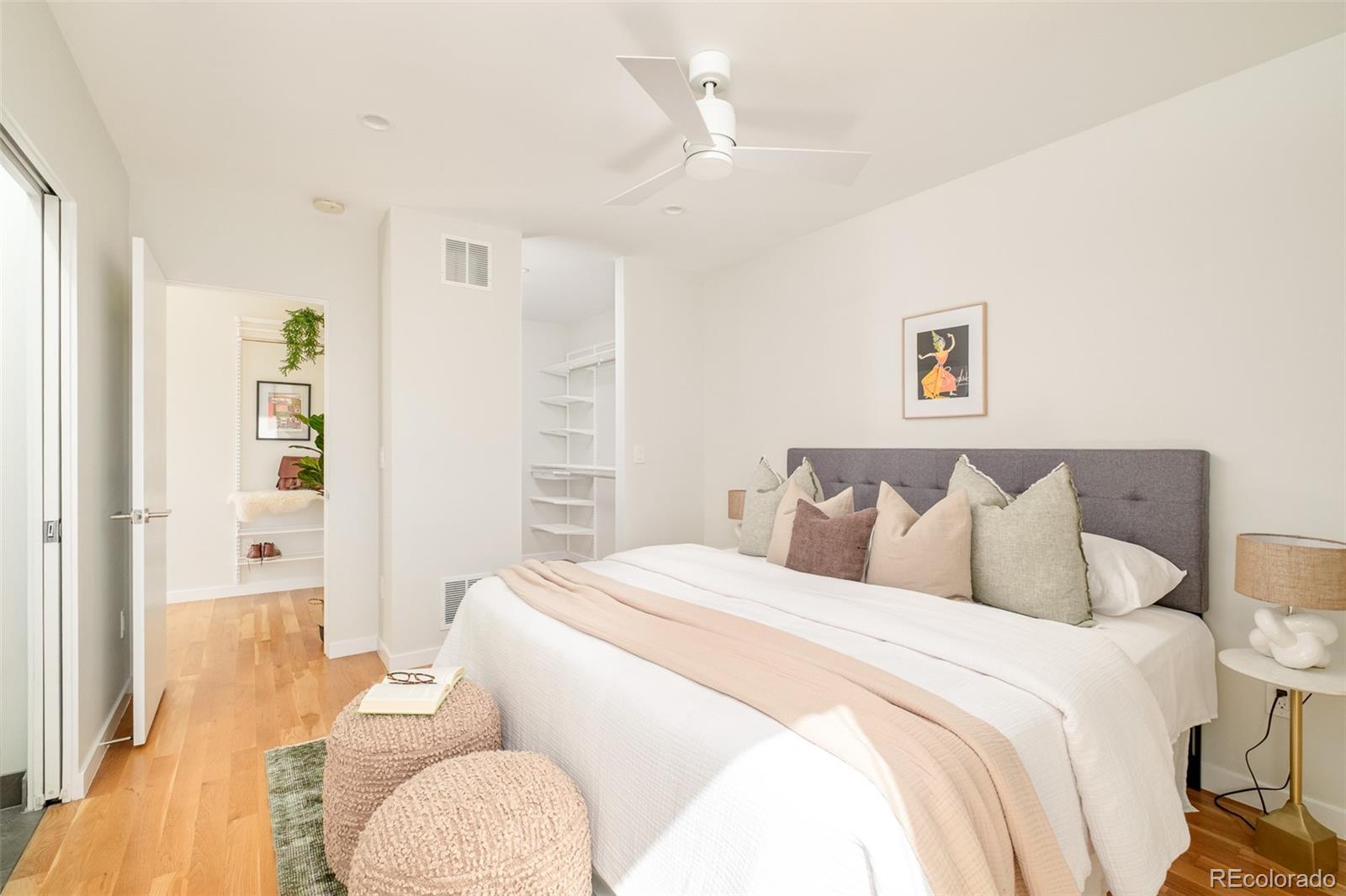 4100 Raleigh Street Denver, CO 80212 - Photo 21 of 48 a bedroom with a bed and wooden floor