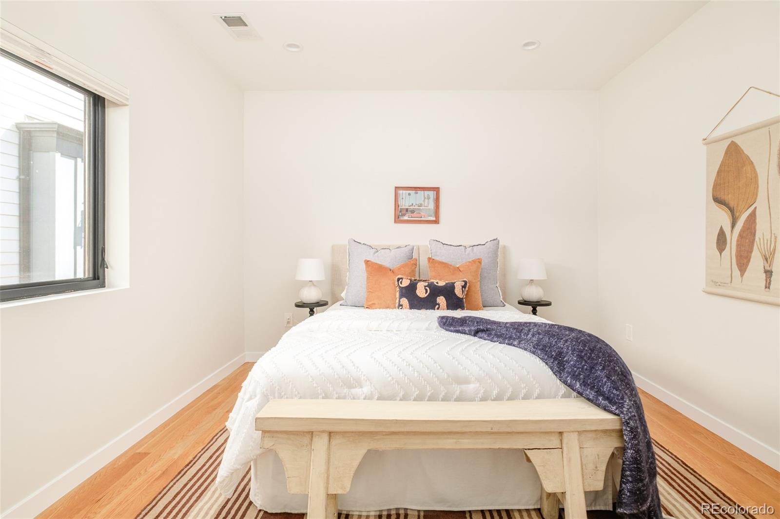 4100 Raleigh Street Denver, CO 80212 - Photo 27 of 48 a bedroom with a bed and a painting on the wall