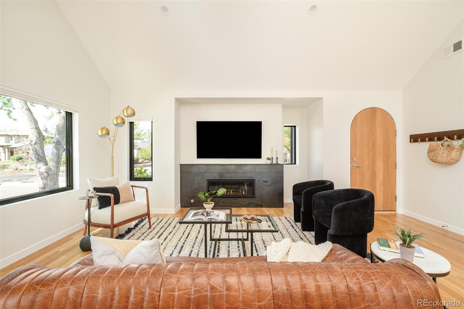 4100 Raleigh Street Denver, CO 80212 - Photo 10 of 48 a living room with furniture fireplace and flat screen tv