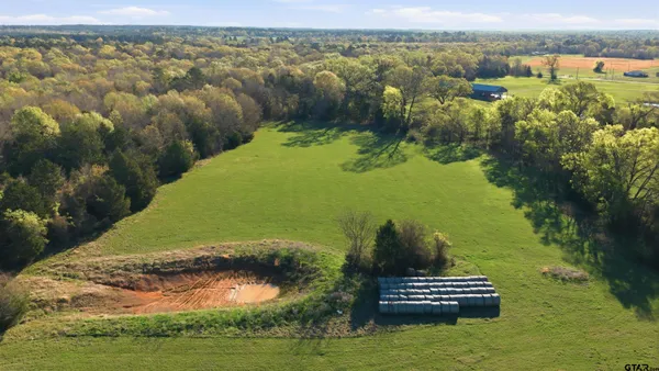 a view of a lake with a yard