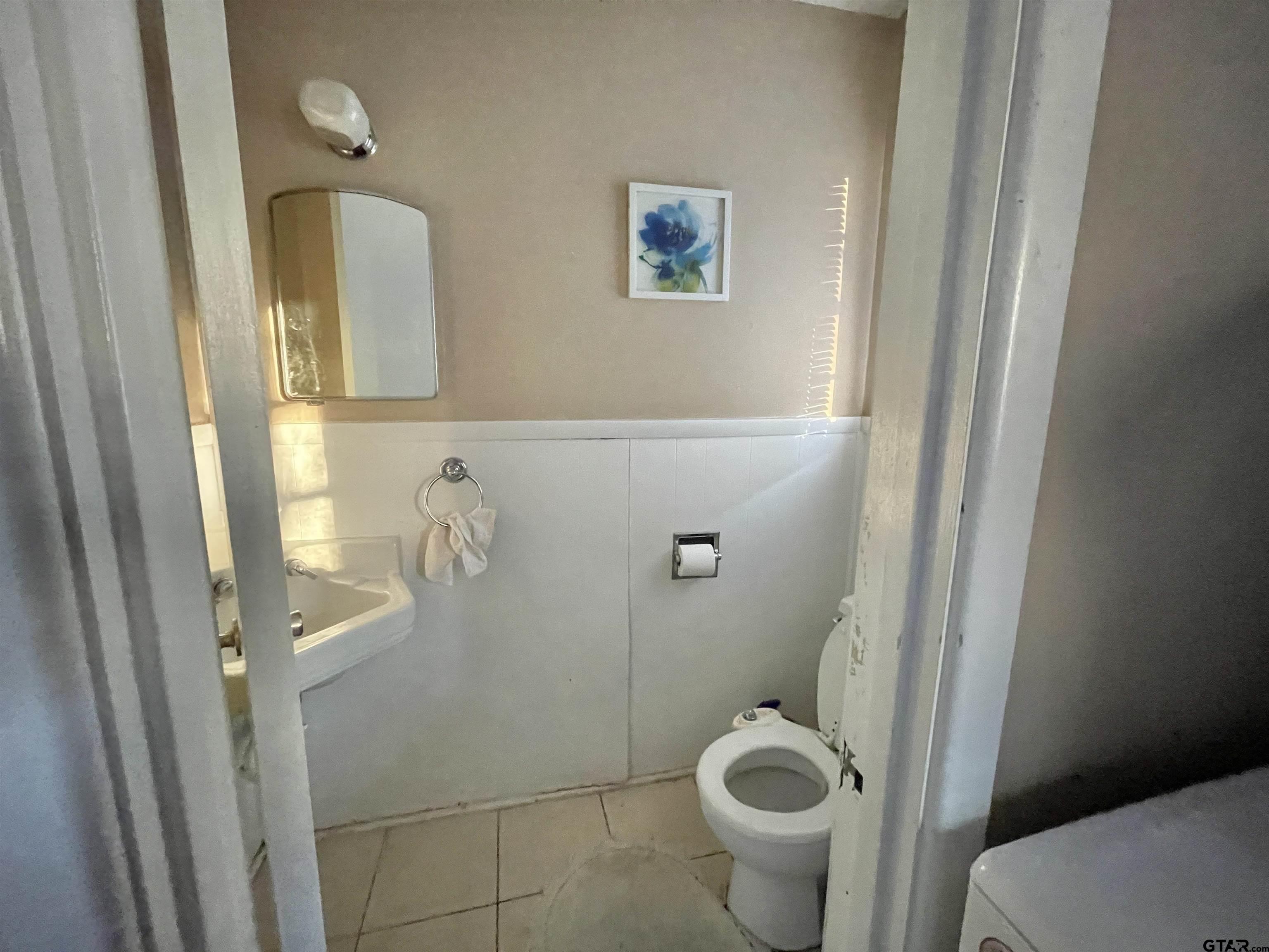 3300 Brookside Drive Tyler, TX 75701 - Photo 17 of 25 a bathroom with a toilet and a shower