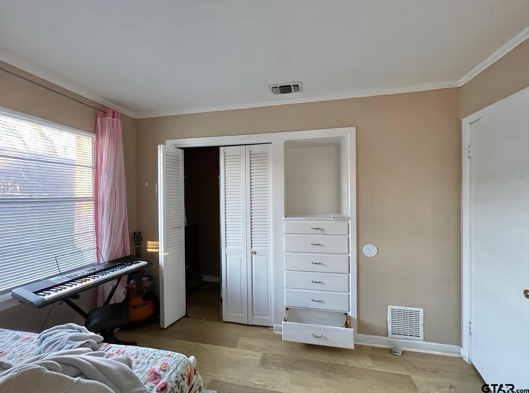 3300 Brookside Drive Tyler, TX 75701 - Photo 20 of 25 a bedroom with a bed and a mirror