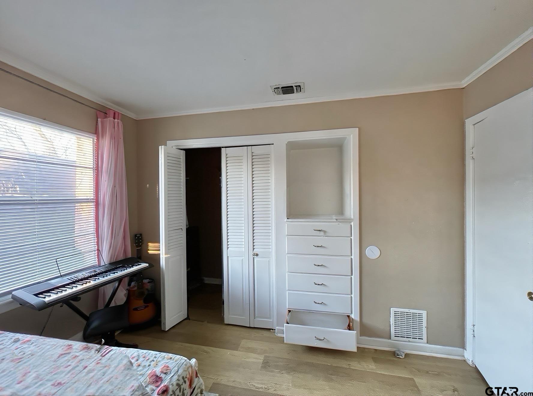 3300 Brookside Drive Tyler, TX 75701 - Photo 21 of 25 a view of a bedroom with closet