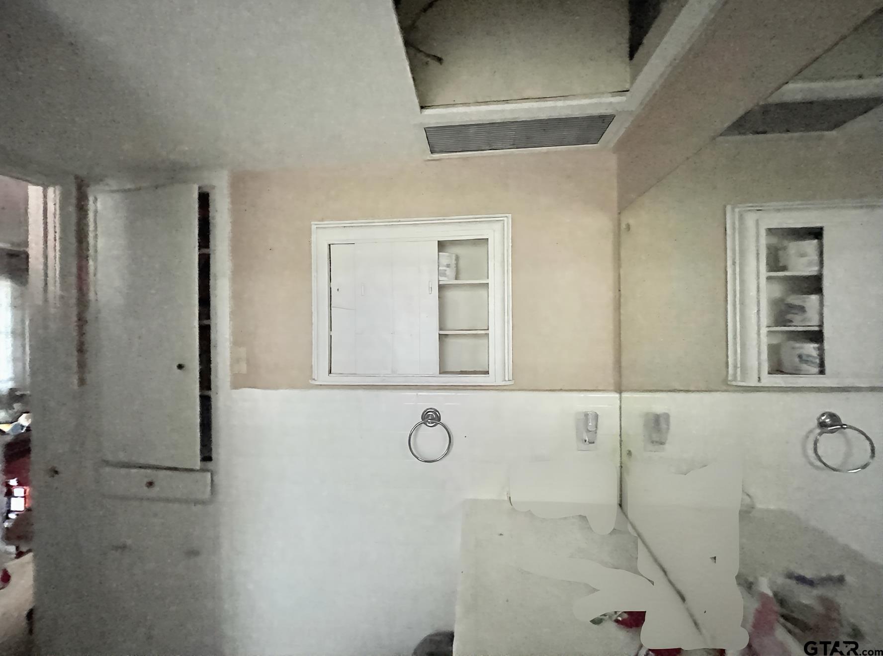 3300 Brookside Drive Tyler, TX 75701 - Photo 23 of 25 a bathroom with a granite countertop sink and a mirror