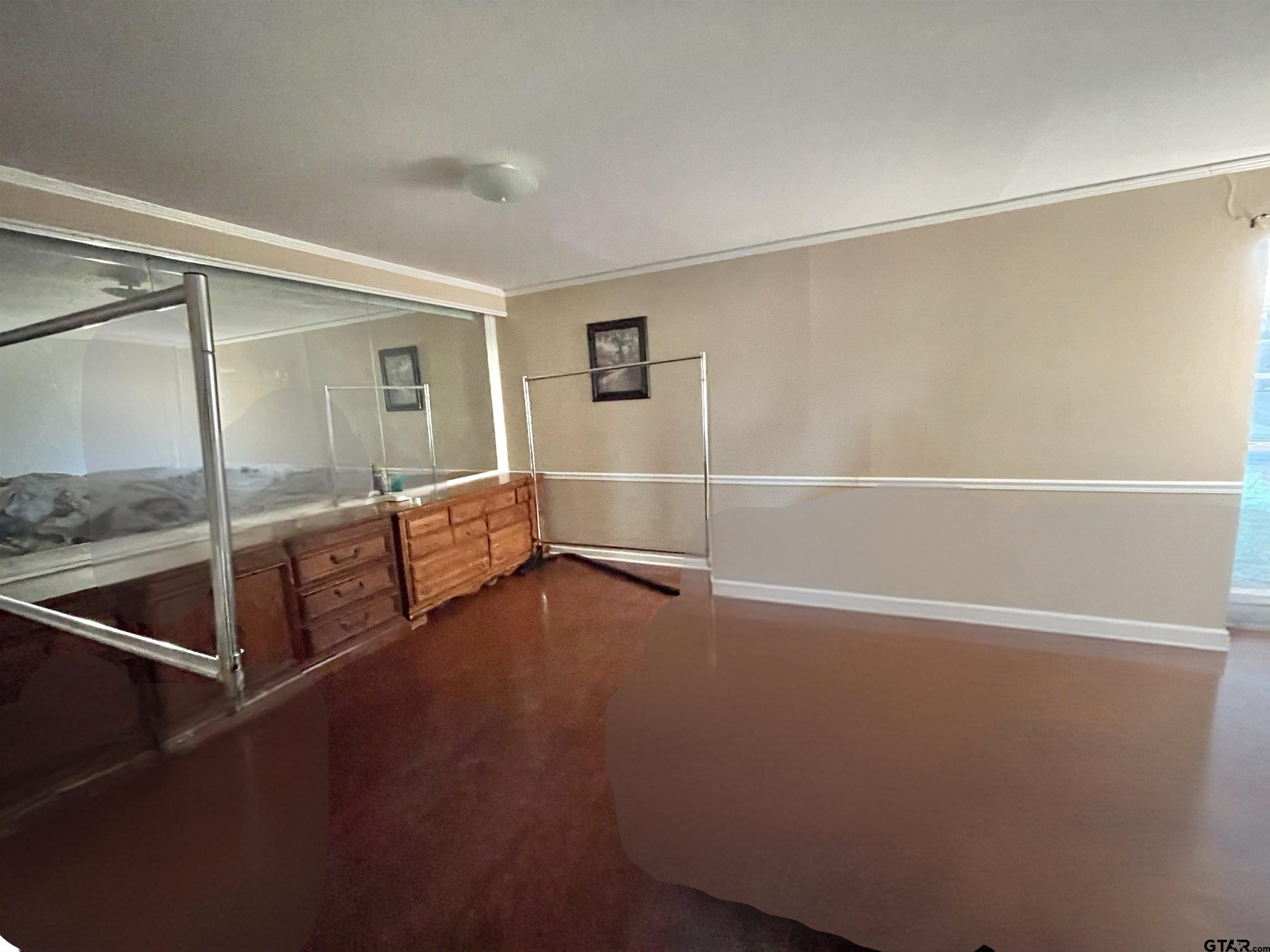 3300 Brookside Drive Tyler, TX 75701 - Photo 25 of 25 a view of an empty room with wooden floor and a window