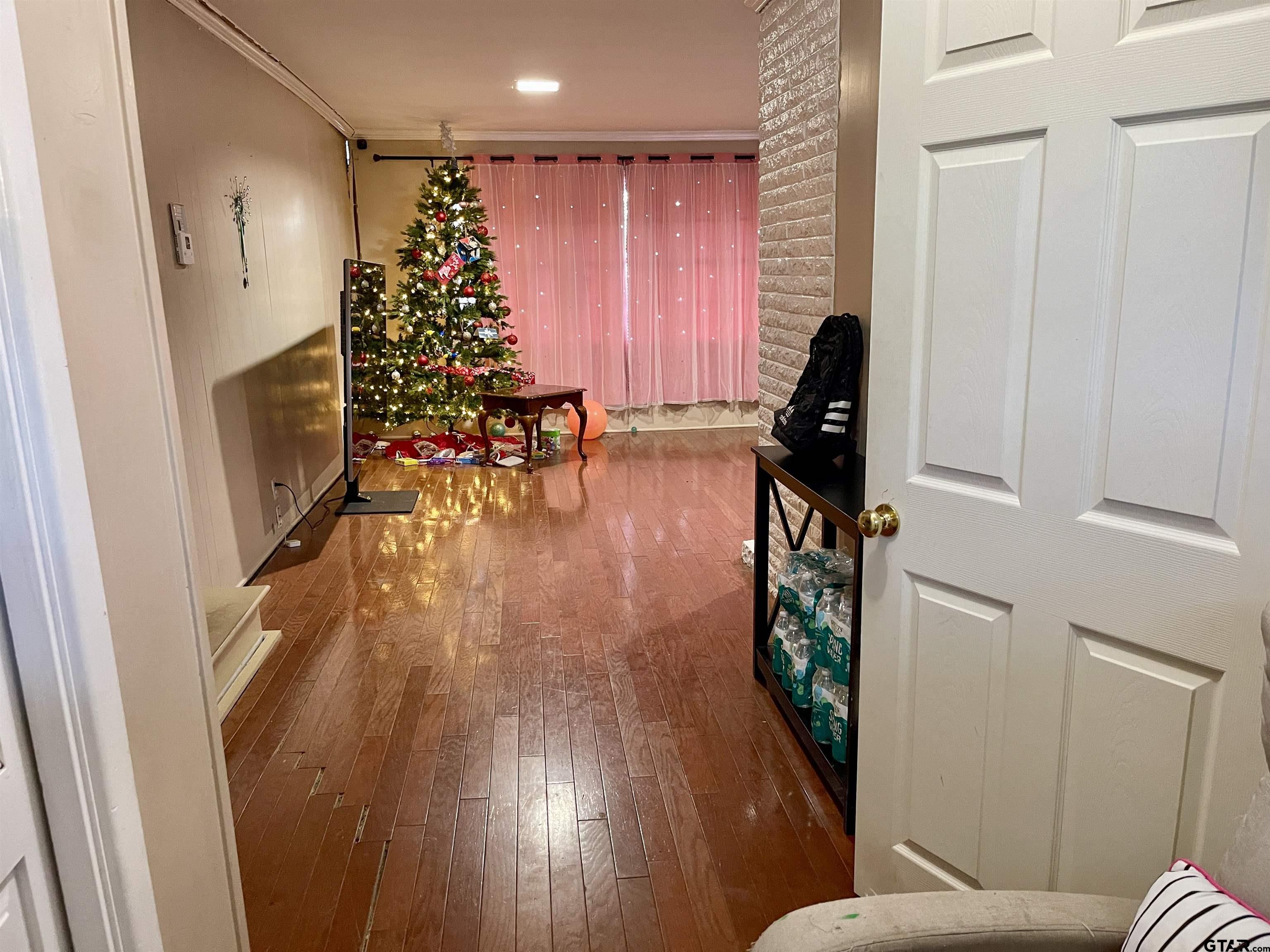 3300 Brookside Drive Tyler, TX 75701 - Photo 6 of 25 a living room with furniture and a hard wood floor