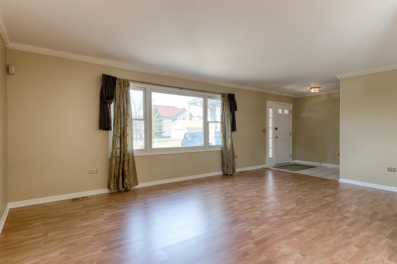 10 Ashcroft Court Bolingbrook, IL 60490 - Photo 2 of 30 an empty room with wooden floor and windows