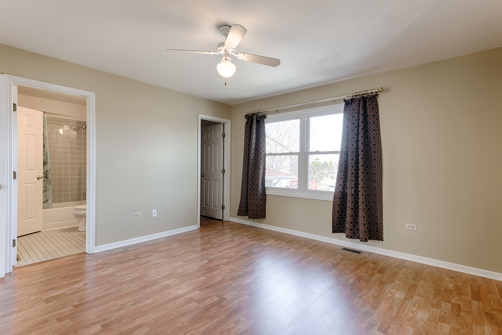 10 Ashcroft Court Bolingbrook, IL 60490 - Photo 14 of 30 a view of an empty room with a window and wooden floor