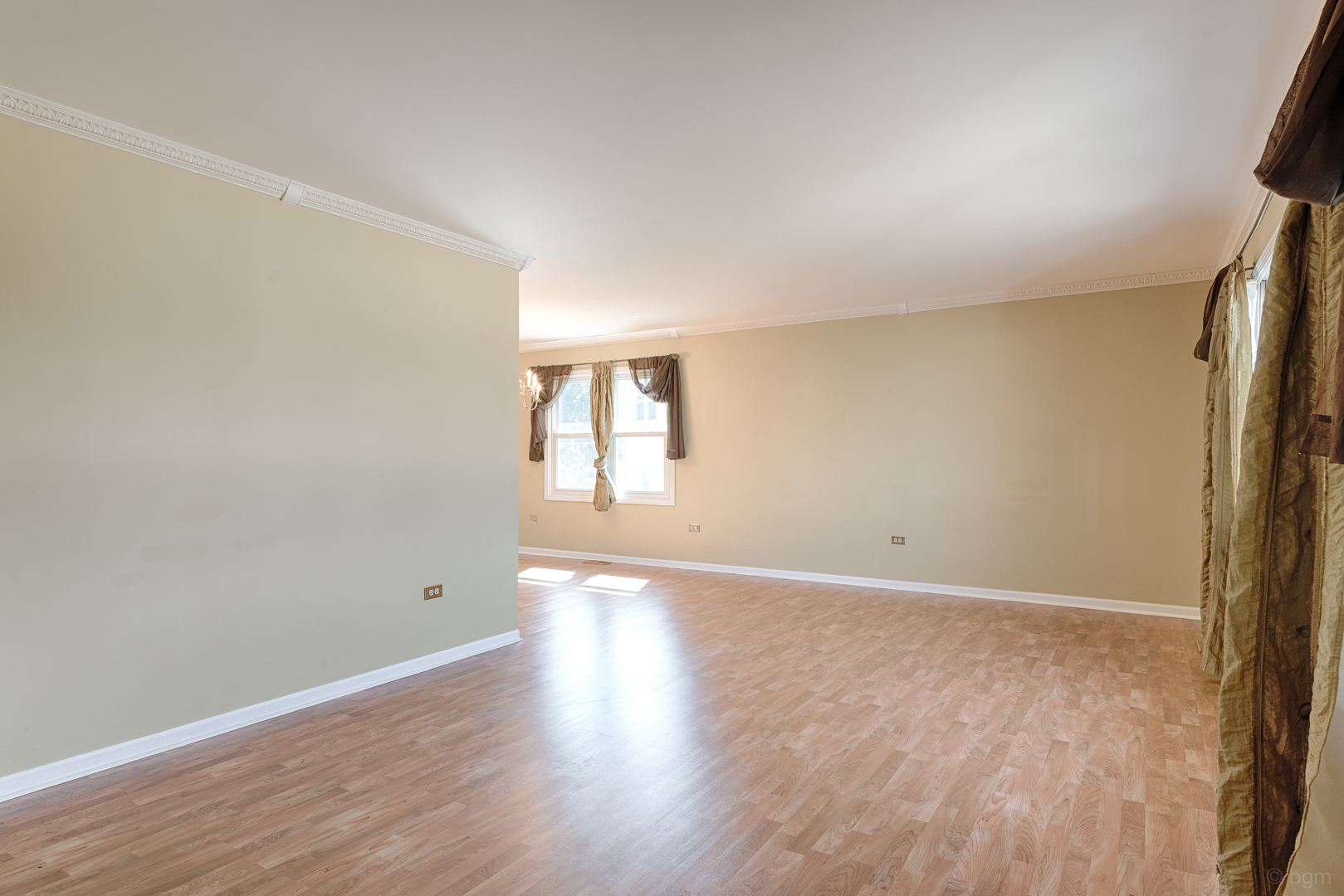 10 Ashcroft Court Bolingbrook, IL 60490 - Photo 3 of 30 a view of an empty room with wooden floor and a window