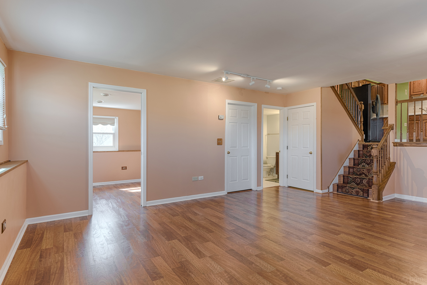 10 Ashcroft Court Bolingbrook, IL 60490 - Photo 21 of 30 a view of an empty room with wooden floor and a window