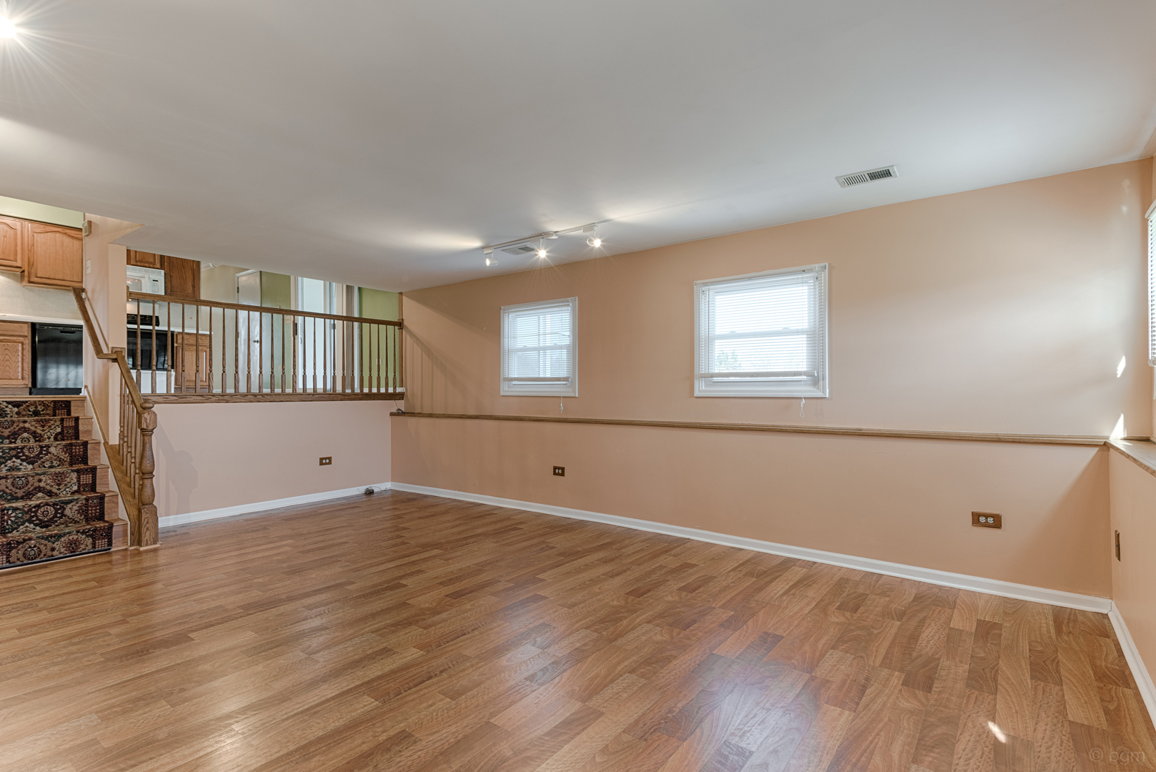 10 Ashcroft Court Bolingbrook, IL 60490 - Photo 22 of 30 an empty room with wooden floor and windows