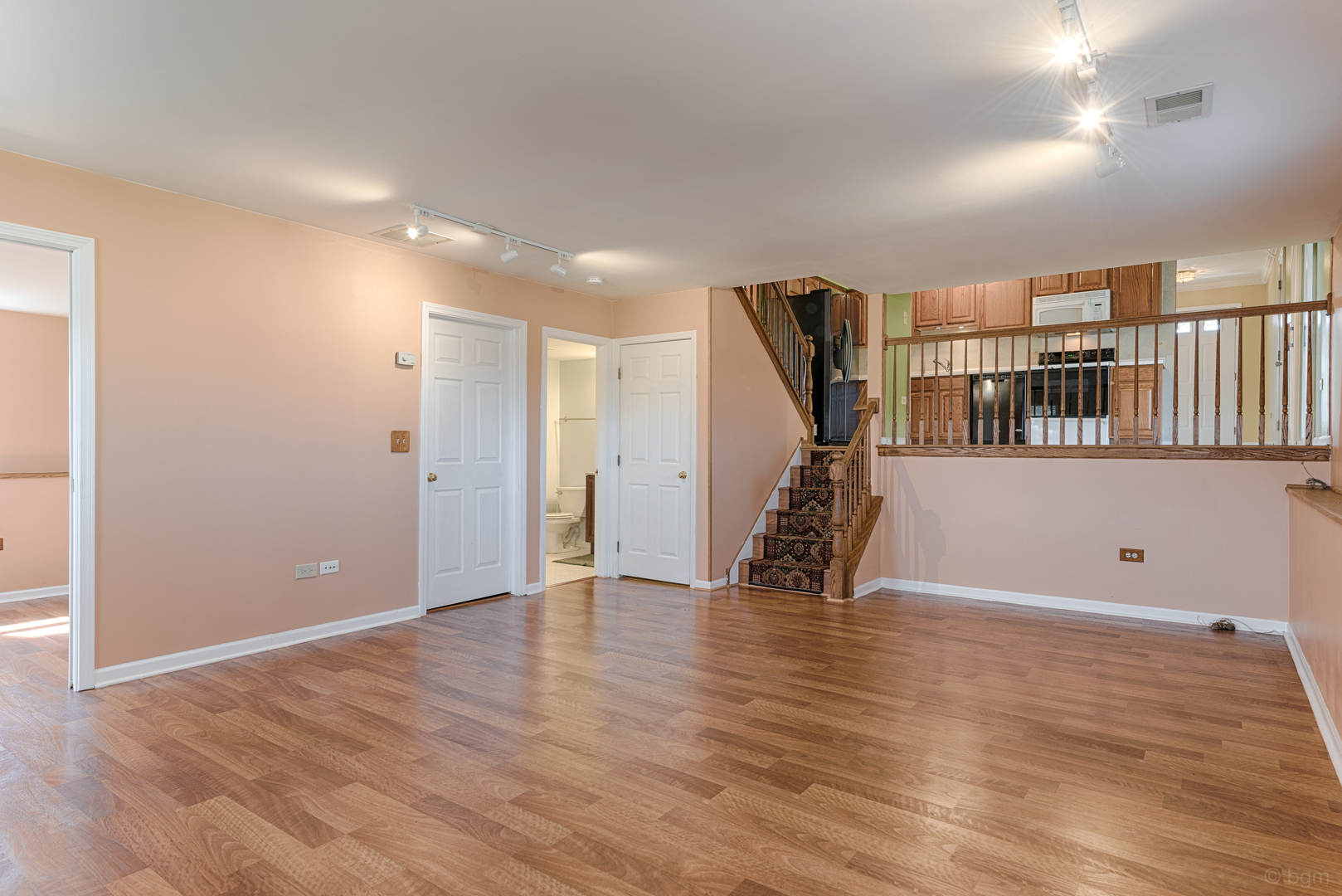 10 Ashcroft Court Bolingbrook, IL 60490 - Photo 23 of 30 a view of an empty room with wooden floor and a window