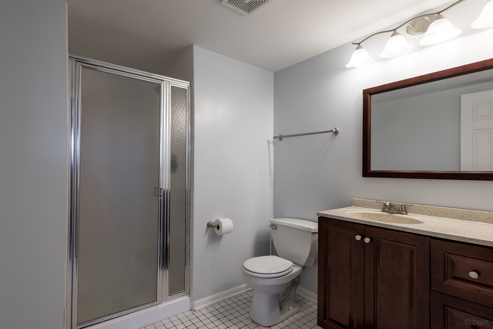 10 Ashcroft Court Bolingbrook, IL 60490 - Photo 26 of 30 a bathroom with a toilet sink vanity and mirror