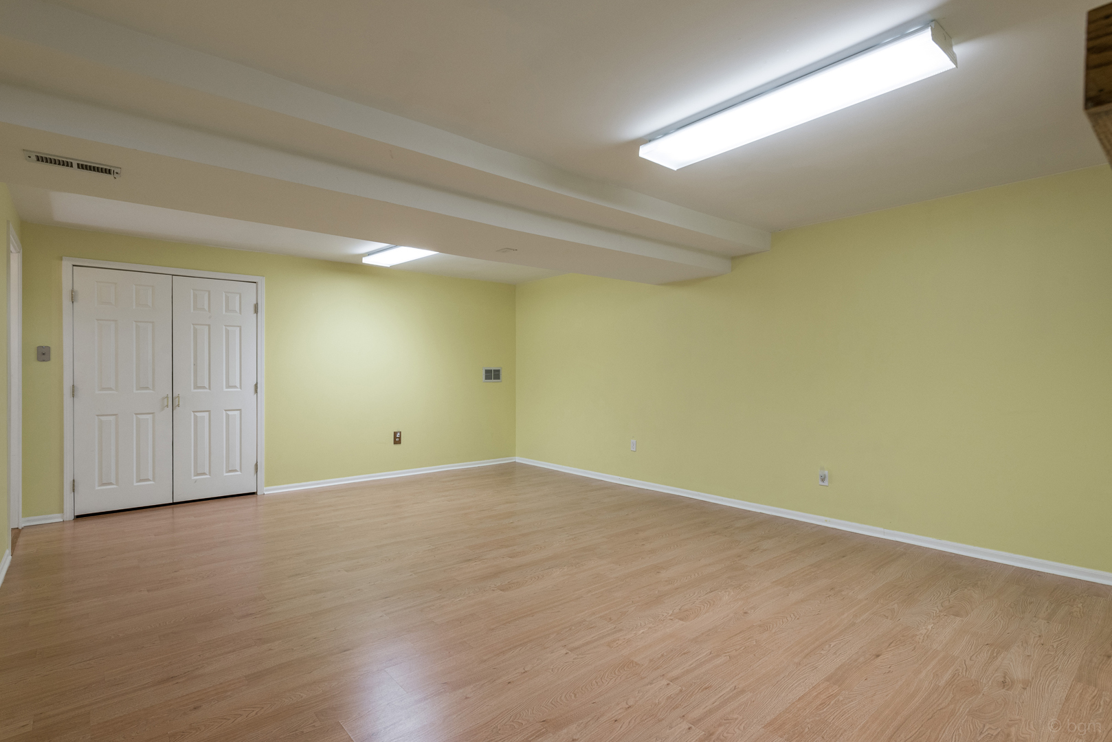10 Ashcroft Court Bolingbrook, IL 60490 - Photo 27 of 30 an empty room with wooden floor and windows