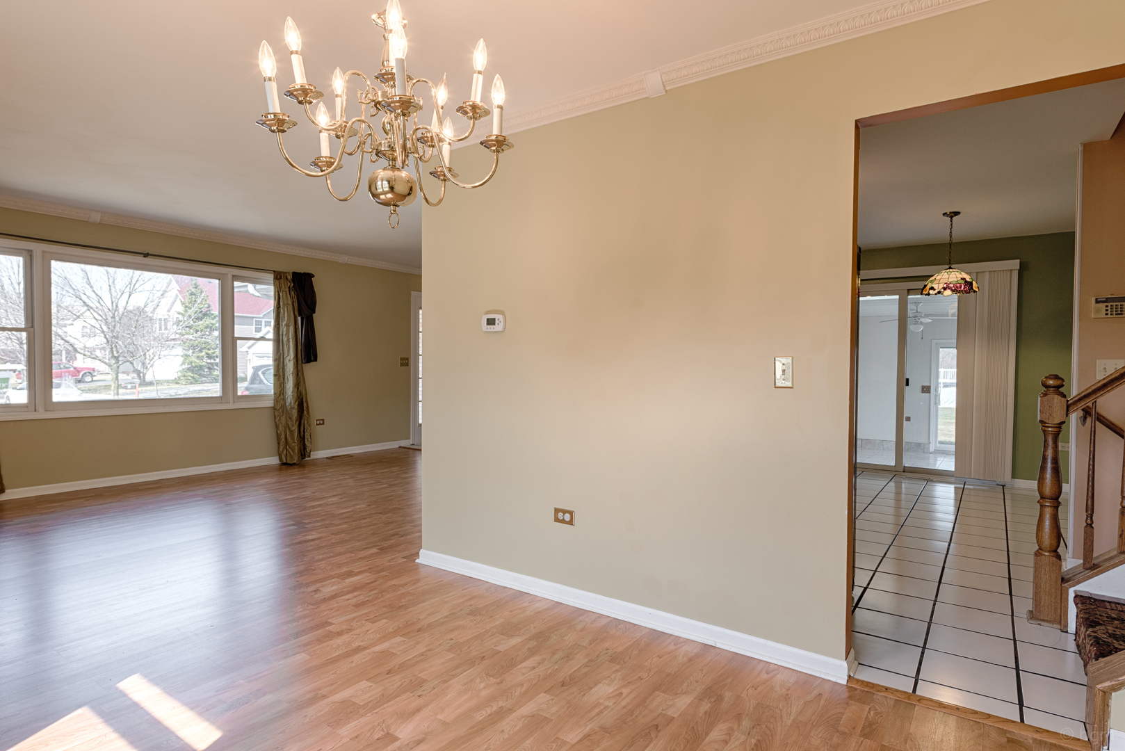 10 Ashcroft Court Bolingbrook, IL 60490 - Photo 7 of 30 wooden floor in an empty room with a window