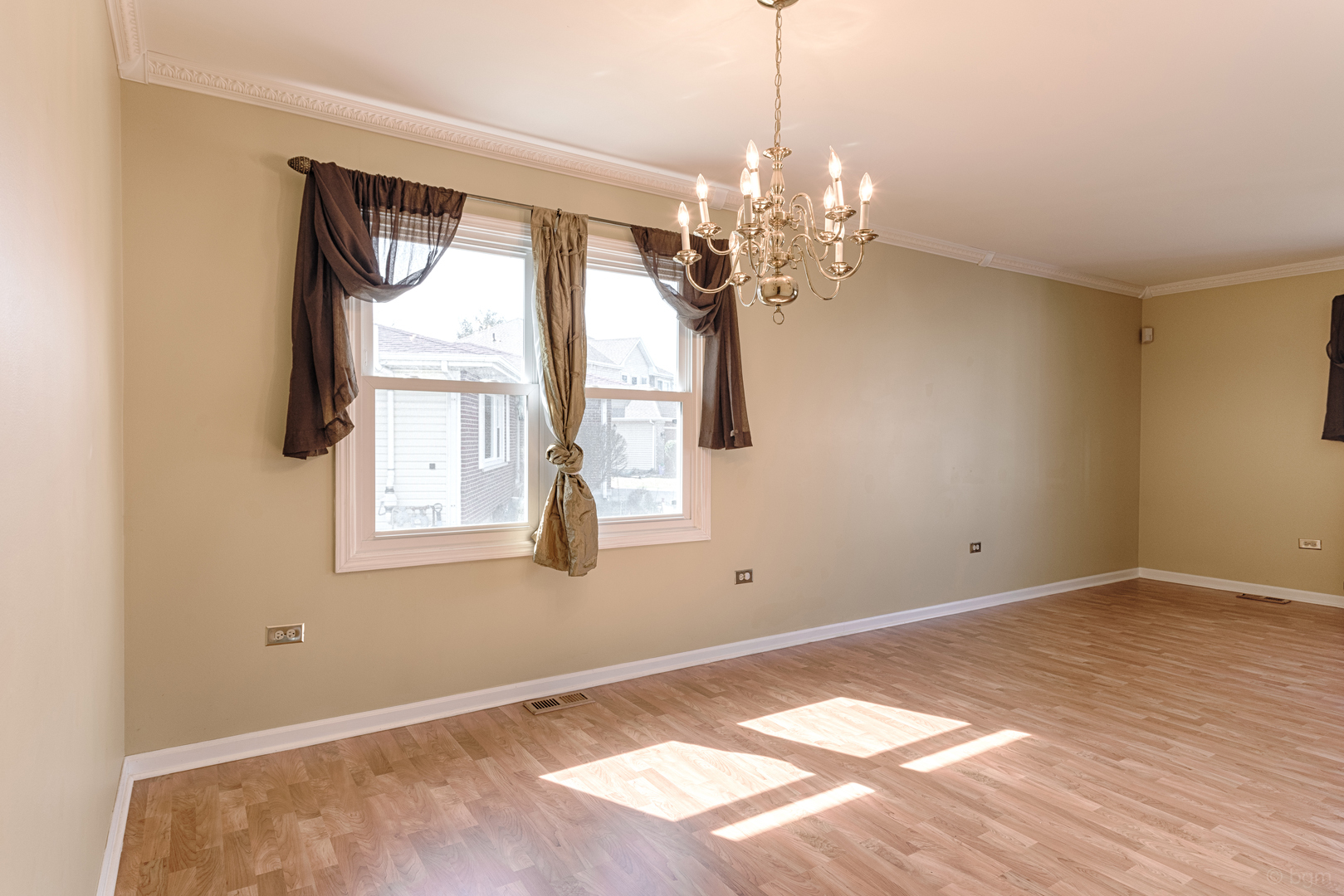 10 Ashcroft Court Bolingbrook, IL 60490 - Photo 8 of 30 a view of an empty room with a window and chandelier