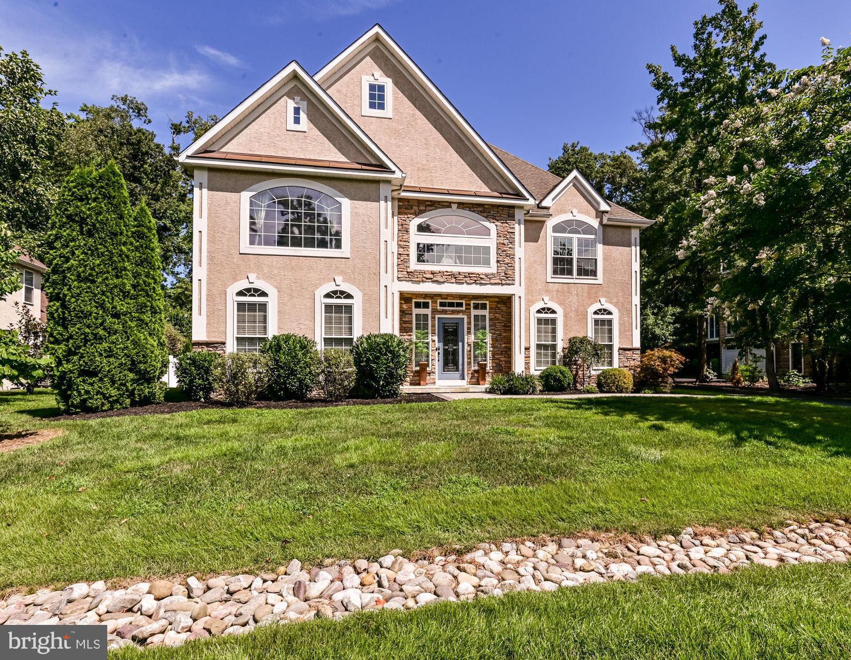 125 Cornwall Road Rehoboth Beach, DE 19971 - Photo 1 of 52 a front view of a house with a yard