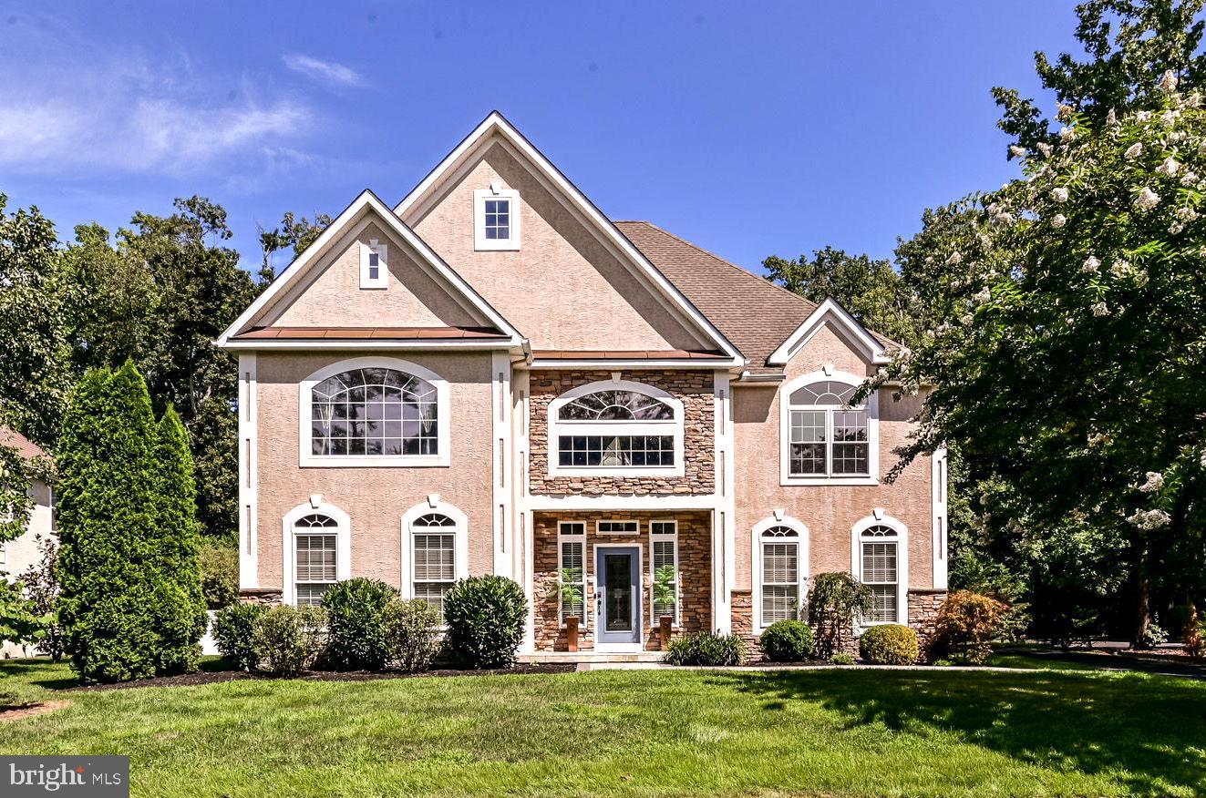 125 Cornwall Road Rehoboth Beach, DE 19971 - Photo 2 of 52 a front view of a house with a yard