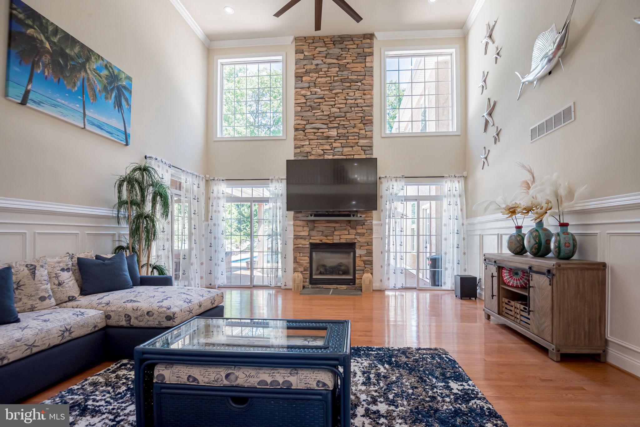 125 Cornwall Road Rehoboth Beach, DE 19971 - Photo 22 of 52 a living room with furniture and a fireplace