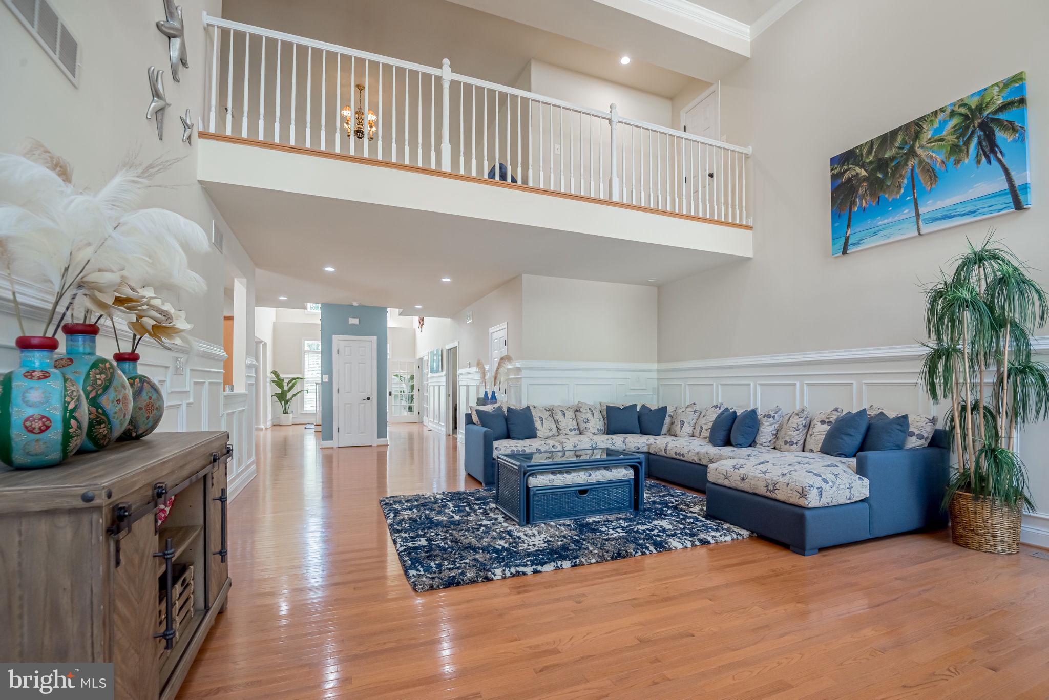 125 Cornwall Road Rehoboth Beach, DE 19971 - Photo 23 of 52 a living room with furniture and a flat screen tv