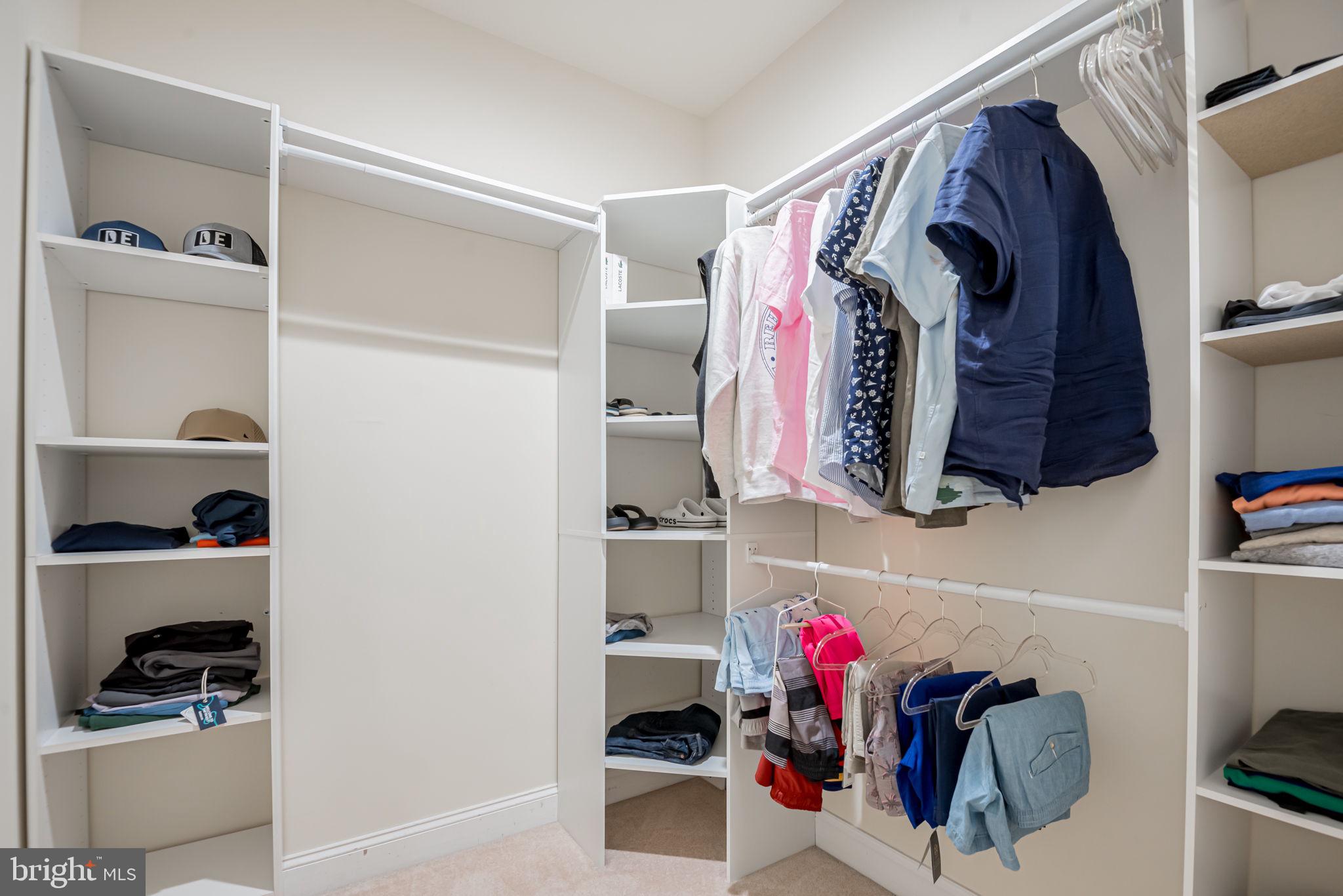 125 Cornwall Road Rehoboth Beach, DE 19971 - Photo 35 of 52 a view of walk in closet with clothes and shoes