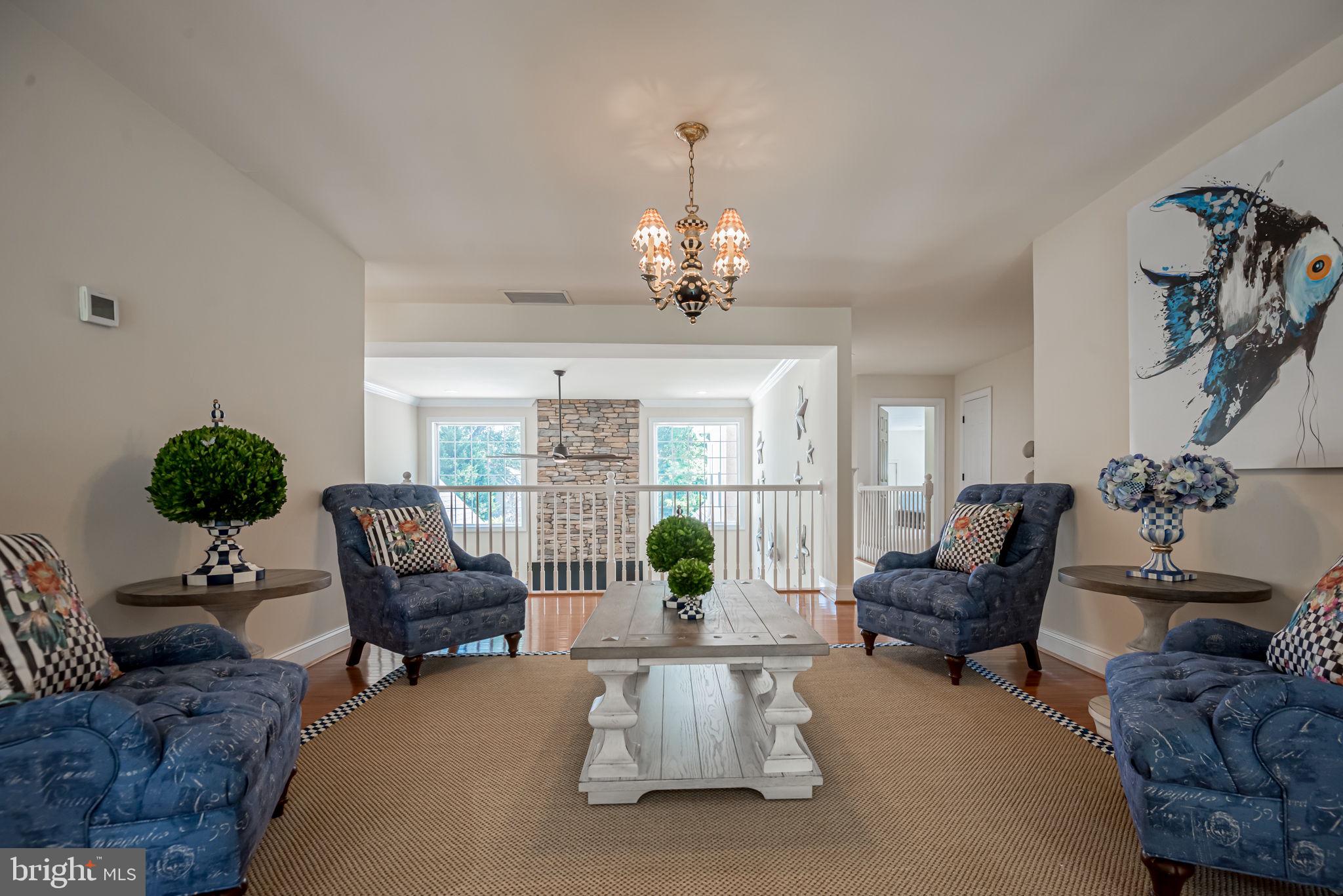 125 Cornwall Road Rehoboth Beach, DE 19971 - Photo 37 of 52 a living room with furniture chandelier and a chandelier
