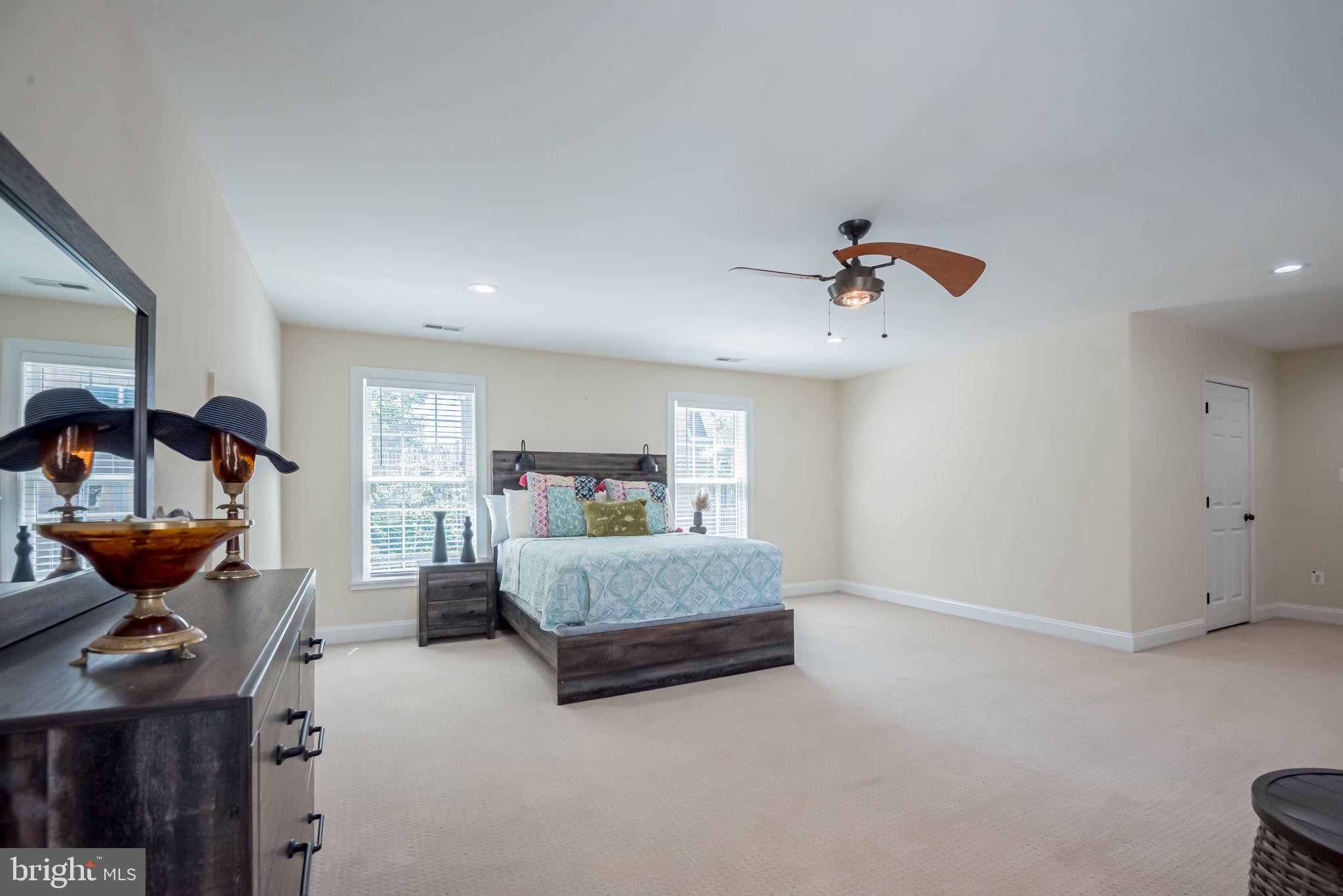 125 Cornwall Road Rehoboth Beach, DE 19971 - Photo 39 of 52 a living room with furniture and a chandelier