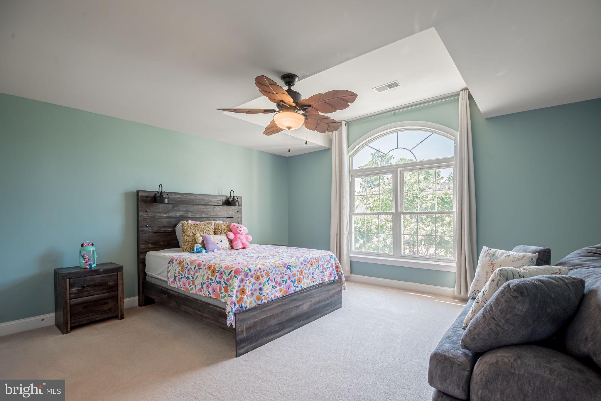 125 Cornwall Road Rehoboth Beach, DE 19971 - Photo 41 of 52 a bedroom with a bed and a large window